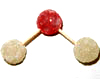 Two white (hydrogen) gumdrops joined by half-toothpicks to one red (oxygen) gumdrop.