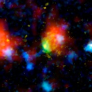 Baby Boom: This fuzzy picture is a galaxy 12.3 billion light years away! It is churning out 4,000 new stars per year. Maybe that's why it is nicknamed "Baby Boom."