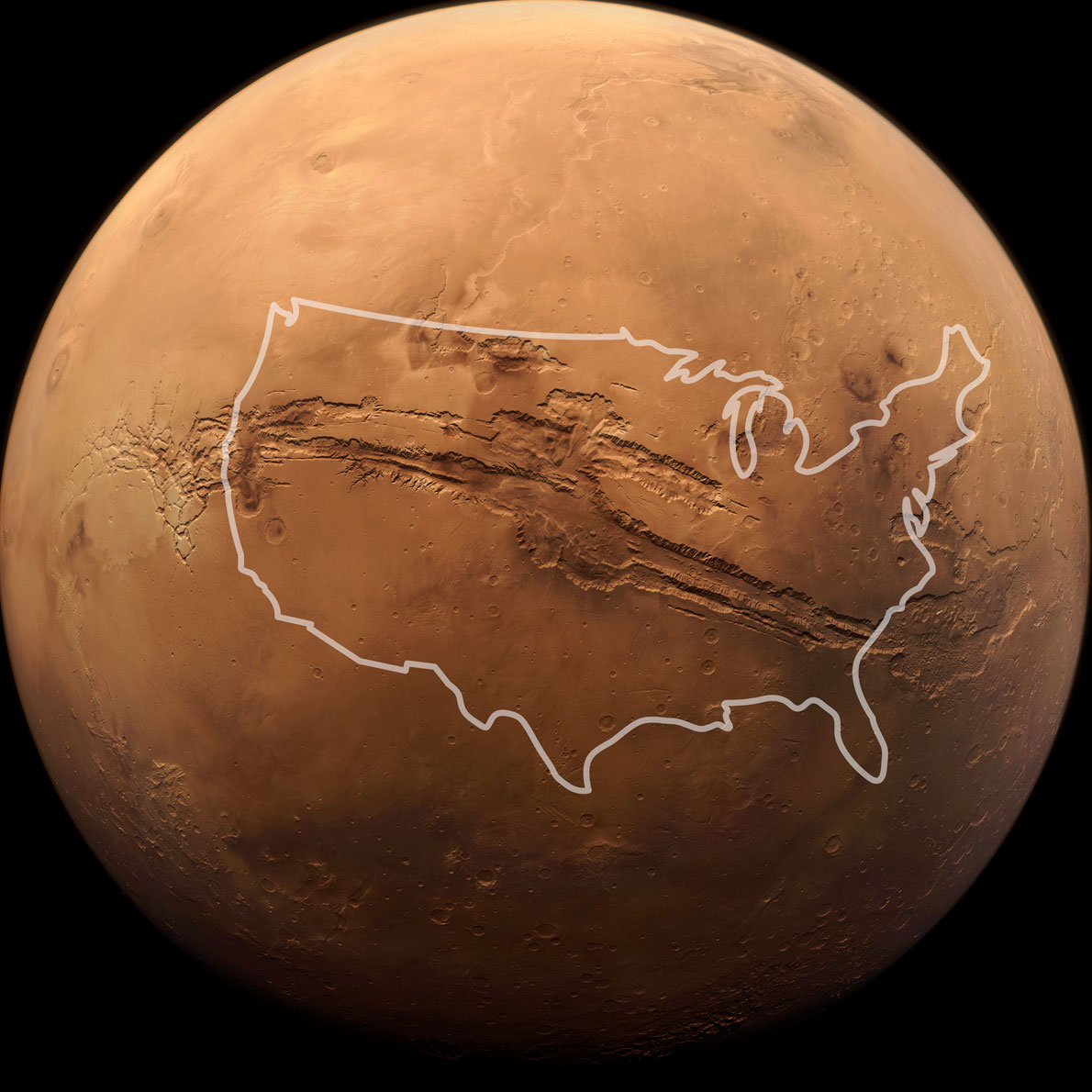 The planet Mars against a black background. An outline of the United States appears over the big canyon in the photo to show how big it is. The canyon appears longer than the United States.