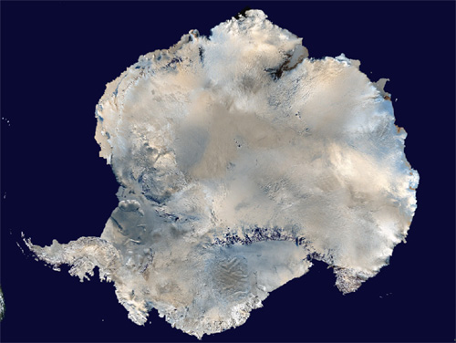Aerial view of the continent of Antarctica surrounded by dark blue oceans.