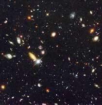 Hubble deep field image showing many galaxies.