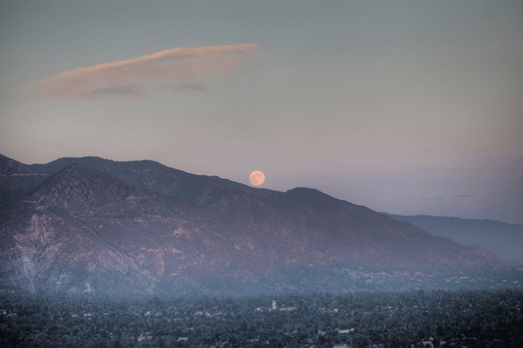 A 'Harvest Moon' rising over the foothills of the San Gabriel Mountains.
