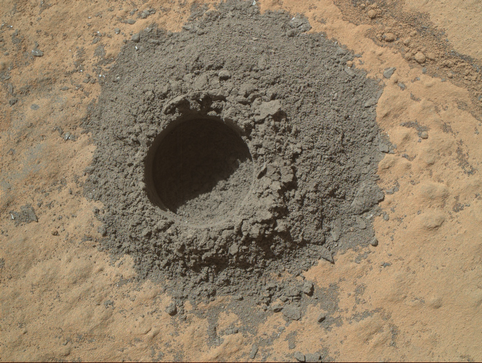 a hole in Martian rock drilled by Curiosity