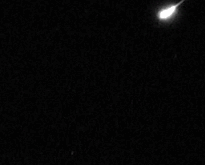 Movie clip showing a shooting star (meteor) streaking across sky.