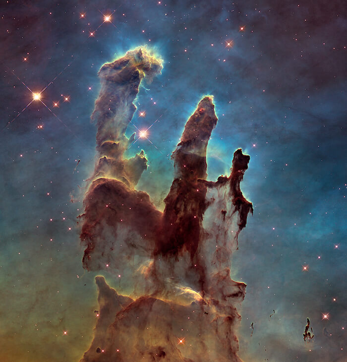 An image of the Pillars of Creation in the Eagle Nebula.