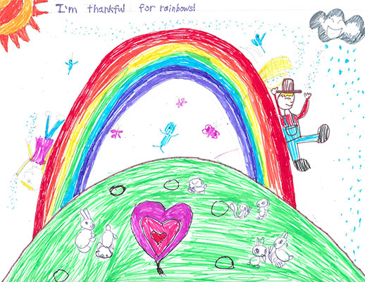 Drawing of a rainbow with people sliding down it.