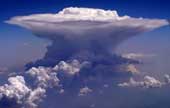 Cumulonimbus cloud with flat anvil shape at the top.