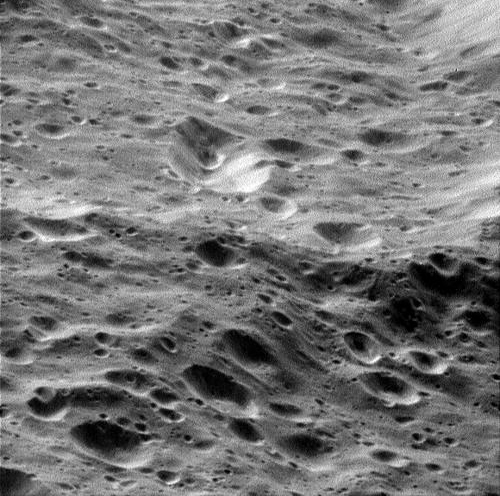 Close-up view of Rhea's heavily cratered surface.