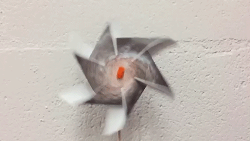 an animated gif of a pinwheel galaxy pinwheel spinning