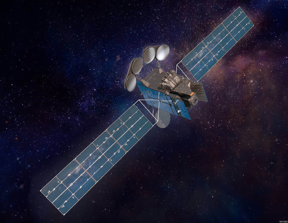 A satellite with long blue solar arrays on each side over a dark, interstellar background.