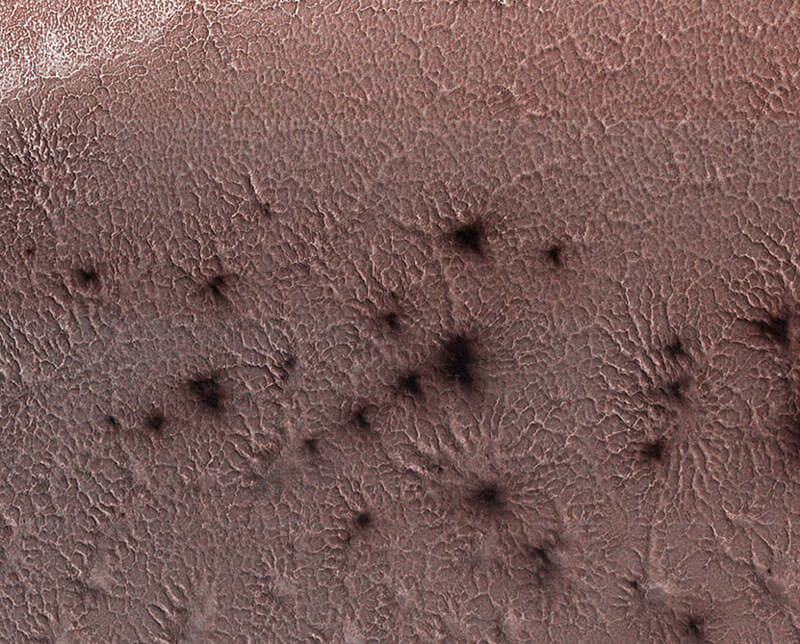 Image of dark dust around Mars vents.