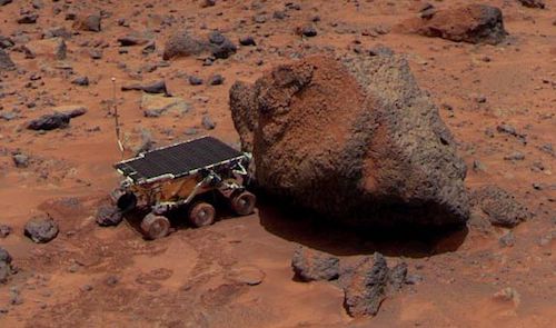 An image of the Soujourner rover exploring Martian terrain.