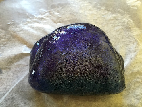 the slime is folded in half enclosing the glitter inside