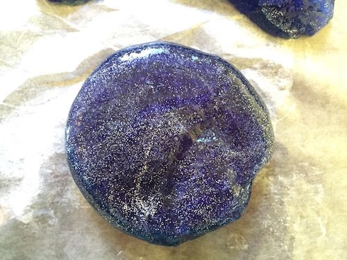 glittery slime on the wax paper