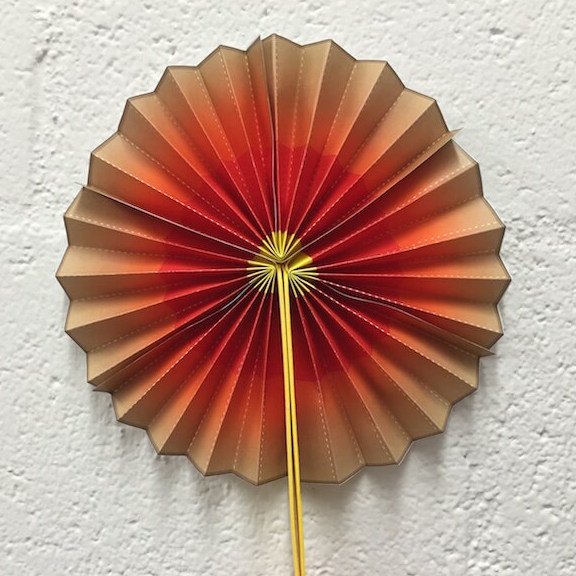 a photo of a paper fan that shows Earth's layers